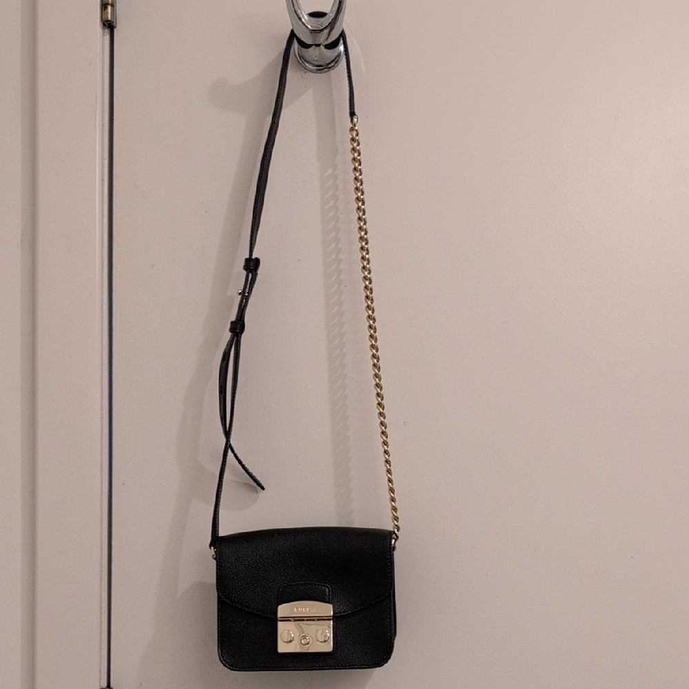 Furla Black and Gold Crossbody Bag with Flap Closure